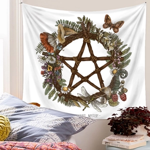 Detail of bohemian tapestry featuring stars and mushrooms with Witchcraft Mystery text