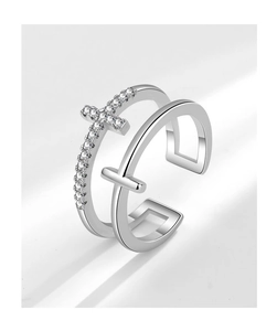 Detail of double-layer adjustable silver ring featuring pave zircon cross and smooth cross
