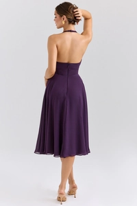 Detail view of deep purple backless halter dress with a sleek invisible back zipper