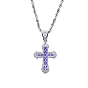 Detailed view of silver cross pendant with purple zircon and micro-pave crystals