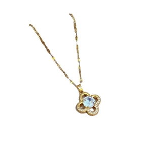 Gold four-leaf clover necklace with sparkling micro-pave crystals and zircon stone