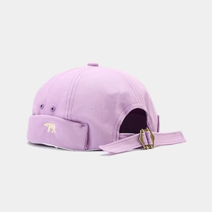 Detail of light purple cotton dockers cap with bear embroidery and adjustable metal buckle