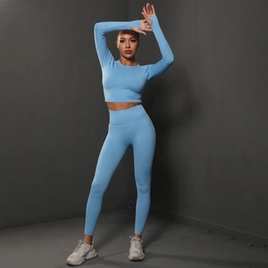 Sky blue seamless yoga set with long sleeve crop top and high waist leggings on model