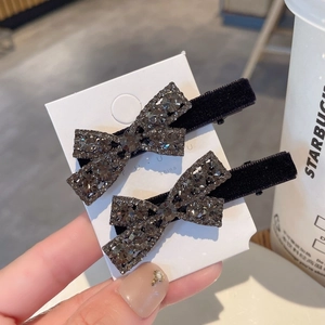 Pair of elegant black velvet bow hair clips with dark grey sparkling rhinestones
