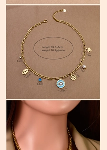 Detail of gold chain necklace with evil eye and pearl charms including size parameters
