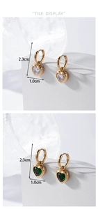 Detail view of heart-shaped crystal drop earrings in gold with dimensions 2.3cm by 1.0cm