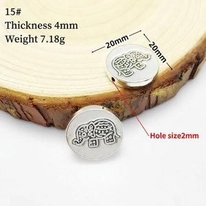 Detailed view of a 20mm silver elephant bead showing thickness and weight measurements