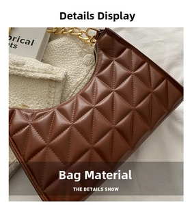 Close-up of brown quilted faux leather texture with elegant golden chain strap