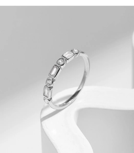 Macro shot of silver S925 geometric ring with sparkling square and round gemstones