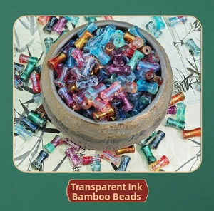 Macro shot of ink-style bamboo glass beads in a ceramic bowl for jewelry DIY
