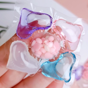 5-in-1 concentrated laundry detergent pods with multi-colored liquid and fragrance beads