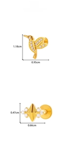 Detailed size view of hummingbird and star titanium studs with zircon inlay