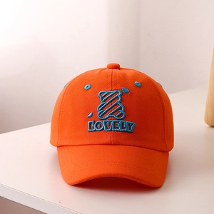 Detail of orange kids baseball cap featuring blue bear embroidery and Lovely text