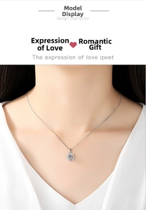 Close-up of S925 silver necklace with a sparkling round zircon pendant on a model's neck