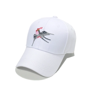 White cotton baseball cap with intricate swallow bird embroidery in a retro Chinese style