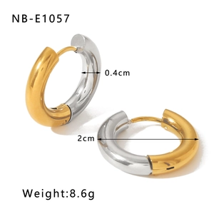 Close-up of dual-tone 2cm gold and silver tube hoop earrings with 18k plating