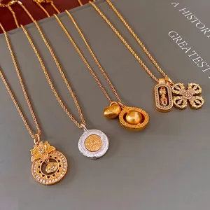Ethnic style gold and silver necklaces featuring lotus and mandala charms on book background
