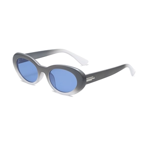 Occhiali da sole retrò cat eye con montatura sfumata grigia e lenti blu da donna
