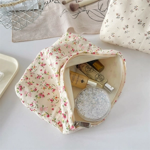 Detailed interior view of floral canvas makeup bag showing large storage capacity