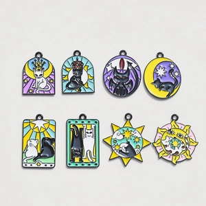 Flat lay set of 8 alloy enamel cat charms with sun moon and star astrology designs