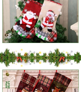 Detail of checkered Christmas stockings with Santa and snowman on a festive pine garland