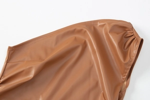 Detail shot of brown PU leather fabric texture with fine stitching and soft folding