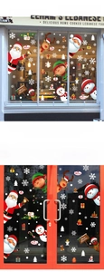 Detailed view of festive Christmas window stickers with Santa, snowman and elk motifs
