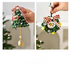 Detailed view of handmade Christmas tree and wreath pendants with velvet finish and bells