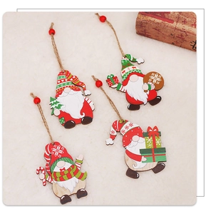Macro view of four assorted wooden Christmas gnomes with string hangers for holiday decor