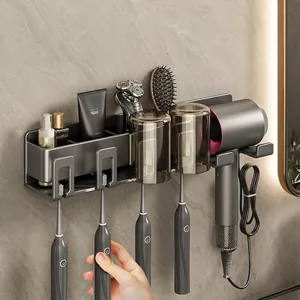 Wall-mounted gunmetal bathroom organizer with hair dryer holder and toothbrush slots
