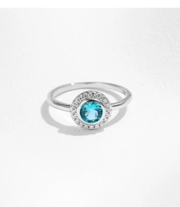 Close-up of s925 silver ring featuring a blue gemstone center with halo diamonds