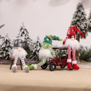 Three Christmas gnomes with snowflake hats and telescopic legs for festive decoration