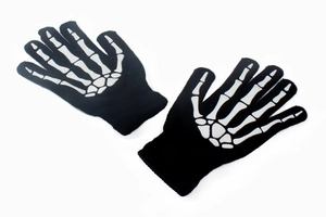 Detail of knitted skeleton bone print gloves with high-contrast black and white design