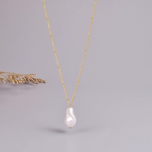 Fashionable gold beaded chain necklace with irregular white baroque pearl pendant
