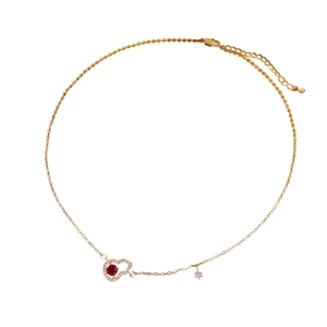 Gold-plated necklace with hollow gourd pendant featuring red gemstones and white zircons
