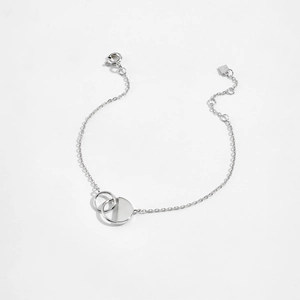 Macro shot of S925 sterling silver interlocking rings on a minimalist bracelet