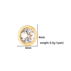 Detail view of 4mm gold bezel stud earring featuring a round white cubic zirconia stone