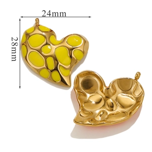 Detail view of heart-shaped leopard print earrings with size dimensions 28mm by 24mm