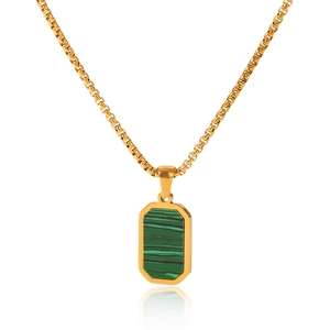 Macro shot of gold square pendant with green malachite stone and classic box chain