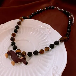 Tiger eye beaded necklace featuring a cute dachshund pendant and adjustable metal chain