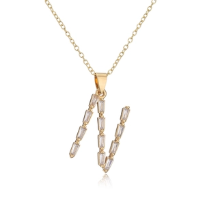 Close-up of 18K gold plated necklace with a sparkling CZ-inlaid letter N pendant