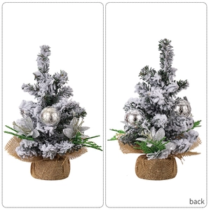 Detailed front and back view of a mini snowy Christmas tree with silver ball ornaments