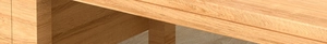 Macro shot of durable ebony wood texture and solid leg structure for kitchen cutting board
