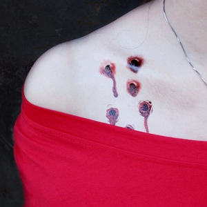 Realistic 3D bullet hole and bloody scar temporary tattoo sticker on model's shoulder