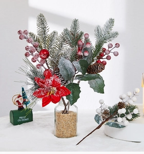 Detailed Christmas pick with red poinsettia, pine needles, and berries in a glass jar