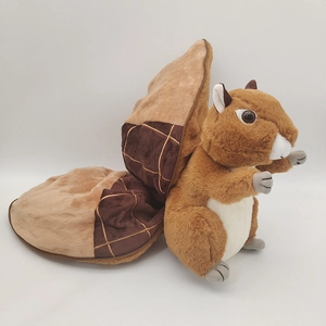 Detail of plush squirrel toy with integrated brown acorn-shaped folding blanket