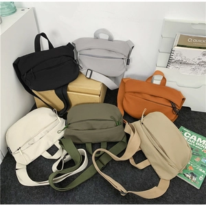 Nylon crossbody sling bags in six different colors displayed for casual outdoor style