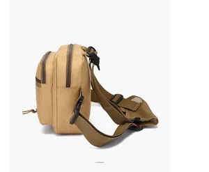 Detailed side view of khaki tactical chest bag showing multiple zipper compartments