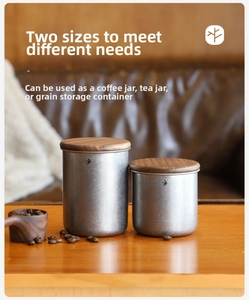 Set of two stainless steel airtight canisters with wooden lids for coffee bean storage