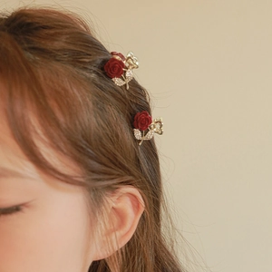 Mini flocked burgundy rose hair claw clips with rhinestones worn on brown hair